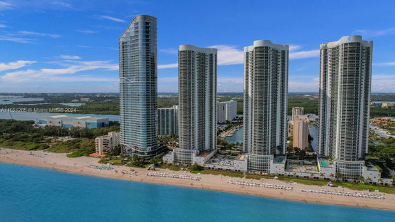 Front view of multiple high-rise buildings along the beach.