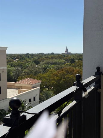 Wide angle view of surroundings from a balcony.