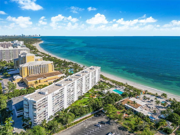 Panoramic view of beachfront buildings and coastline.