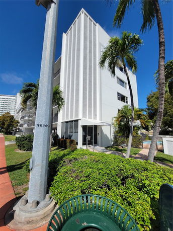 Front view of a multi-story building with modern design elements.