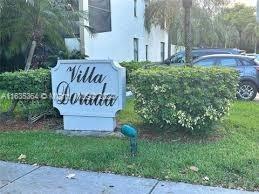 Front view of a building with a sign reading 'Villa Dorada'.