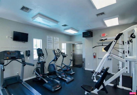 Interior of a gym with exercise equipment and fitness machines.
