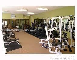 Interior view of a gym area with various exercise equipment.
