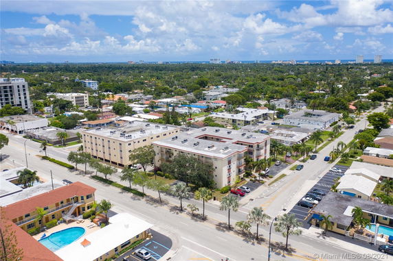 Aerial view of a neighborhood with various buildings and streets.