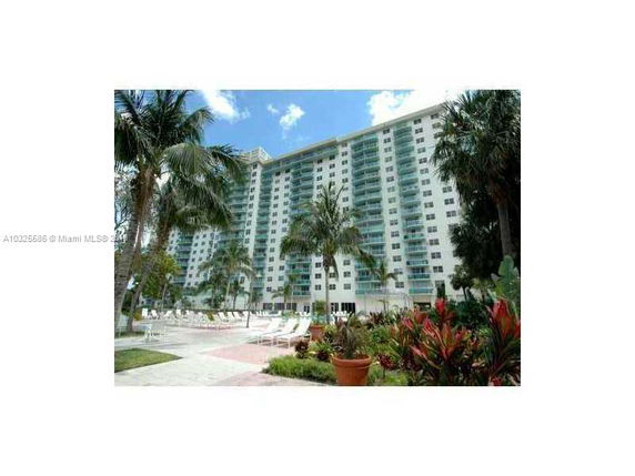 Front view of a high-rise residential building with balconies.