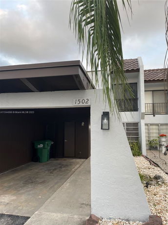 Front view of a house with an attached garage.