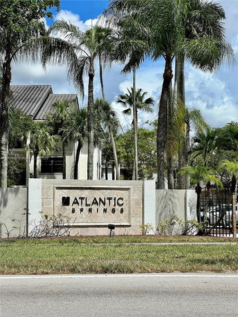 Front view of a building entrance with a sign that reads 'Atlantic Springs'.