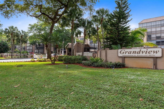 Front view of a multi-story building with a sign reading 'Grandview at Emerald Hills.'