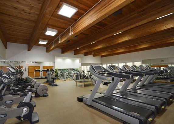 Indoor gym with treadmills and exercise equipment.