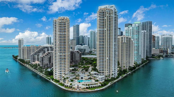 Panoramic view of a collection of high-rise buildings on a waterfront.