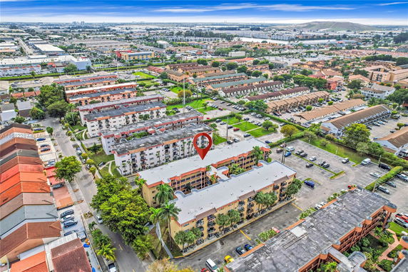 Aerial view of a residential area with multiple apartment buildings and roads.