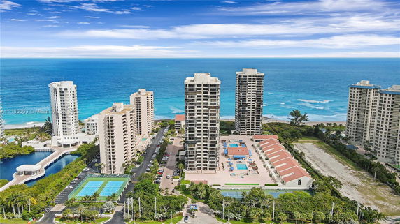 Panoramic view of high-rise buildings by the ocean.