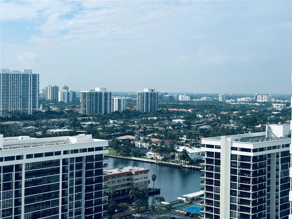 Panoramic view of high-rise buildings and surrounding areas from above.