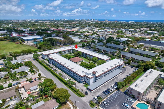 Aerial view of a residential area with multiple buildings and roads.
