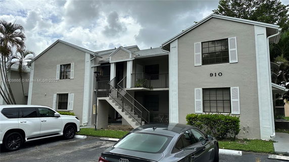 Front view of a two-story residential building with multiple units.