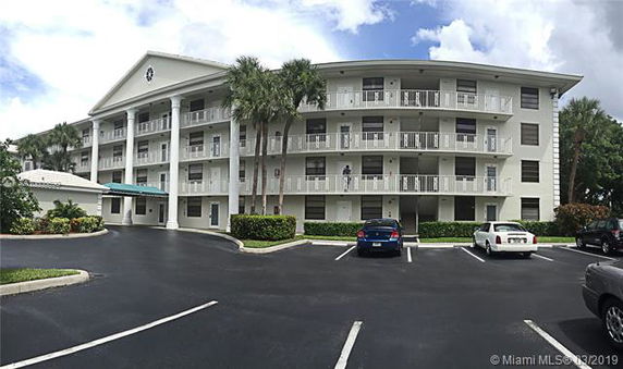 Front view of a multi-story residential building with balconies
