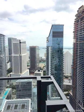 Panoramic view of city skyscrapers from a high vantage point.