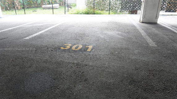 Outdoor parking space marked with the number 301.