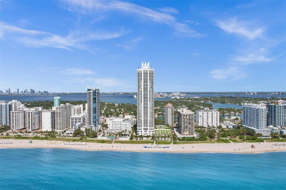 Aerial view of beachfront high-rise buildings.