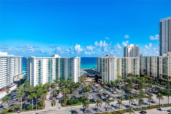 Panoramic view of high-rise buildings near a coastline.