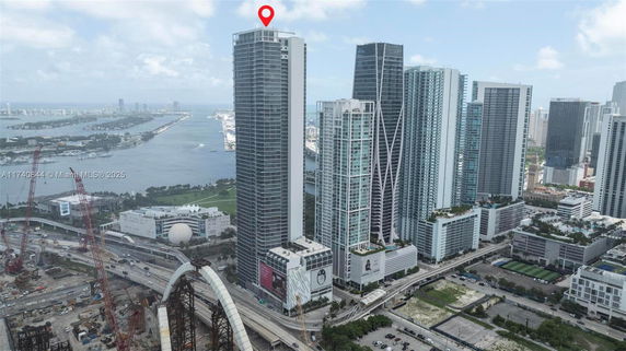 Aerial view of high-rise buildings near a body of water.