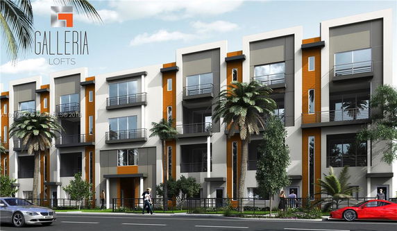 Front view of a multi-story apartment building with modern design.