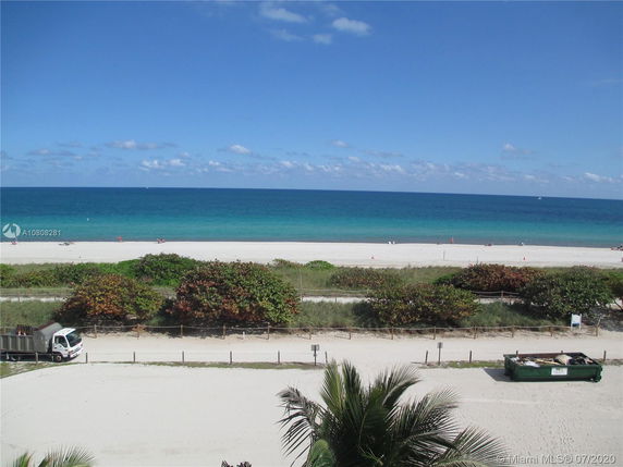 View of the beach and ocean from a higher vantage point.