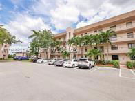 Front view of a multi-story residential building with balconies.
