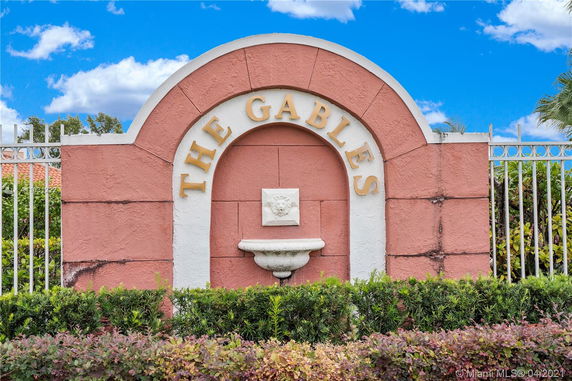 Entrance sign of a property with the name 'The Gables' displayed on a decorative wall.