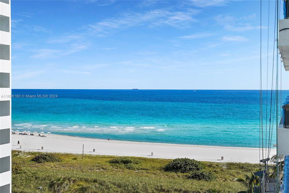 Wide angle view of the ocean and beach from a building.