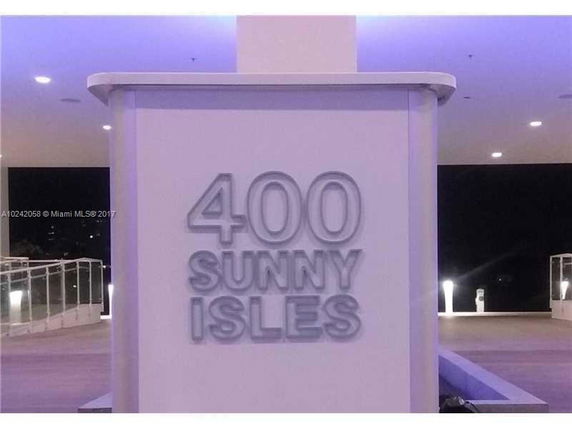 Front sign of a building labeled '400 Sunny Isles'.