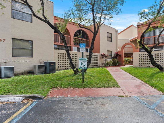 Front view of a residential building with an arched entrance.