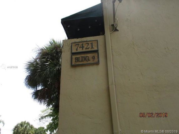 Exterior view of a building corner with address number 7421 BLDG. 9 displayed.
