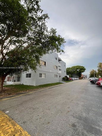 Front view of a multi-story apartment building.
