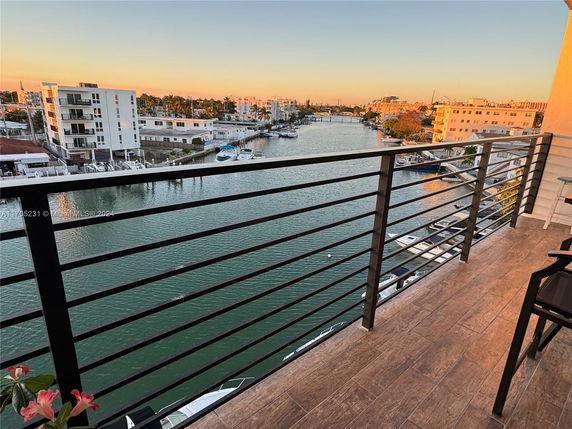 Panoramic view of a waterfront area with buildings and boats.
