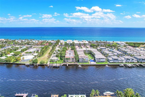 Panoramic view of coastal buildings and the ocean.