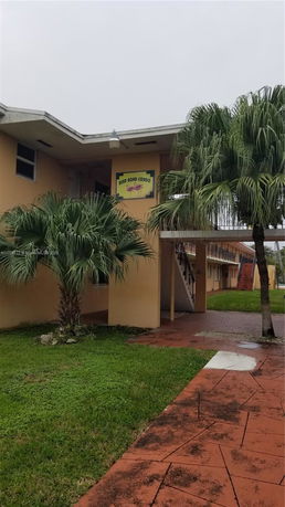 Front view of a two-story condo building.