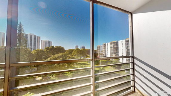 View of surrounding buildings and greenery from the building.