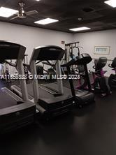 Indoor gym area with treadmills and exercise equipment.