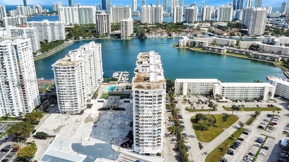 Aerial view of high-rise residential buildings near a waterfront.