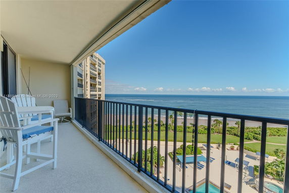 Balcony view overlooking the ocean and coastline.
