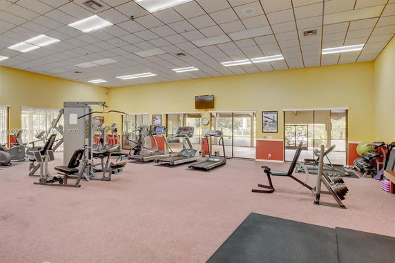 Indoor gym area with fitness equipment and exercise machines.