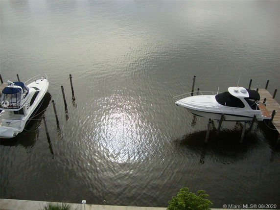 View of boats docked on a water body.