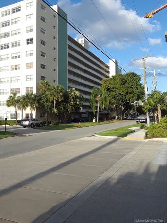 Front view of a multi-story apartment building.