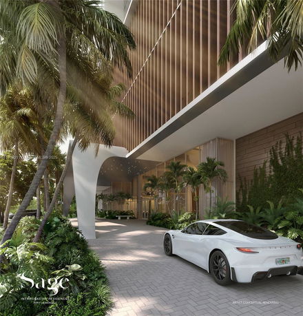 Front view of a modern building entrance with a covered driveway.