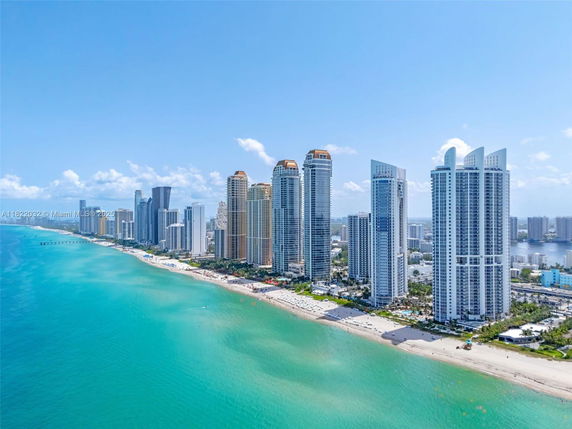 Panoramic view of oceanfront skyscrapers along the beach.