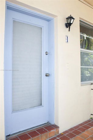 Front view of a house entrance with a light blue door.