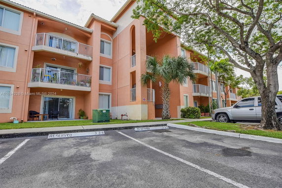 Front view of a multi-story building with balconies.
