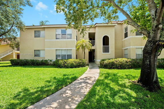 Front view of a two-story apartment building with a central entrance.