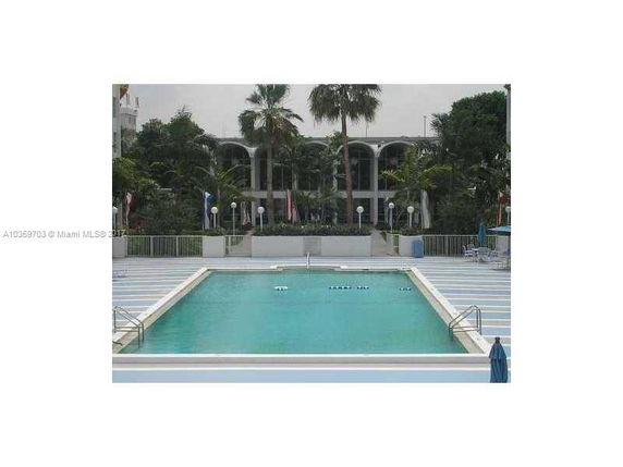 Outdoor swimming pool with surrounding seating area